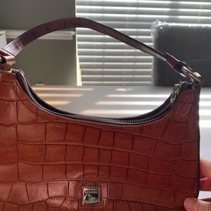 Dooney and Burke brown shoulder bag.